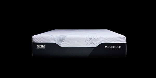 A mattress shown from the side against a solid black background, featuring a white textured top and a black base with the brand names REFLEX and MOLECULE visible.