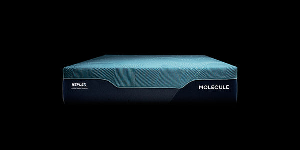A mattress shown from the side against a solid black background, featuring a textured teal top section and a dark navy base with 'REFLEX' and 'MOLECULE' branding.