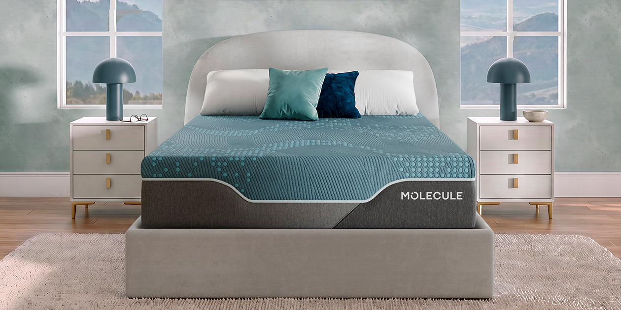 MOLECULE Reflex Elite Hybrid Firm Mattress on a bed in a light blue-green room