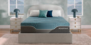 MOLECULE Reflex Elite Hybrid Firm Mattress on a bed in a light blue-green room